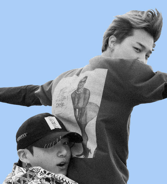 Jungkook holds Jimin Titanic-Style as both of them look over their shoulders toward the camera.